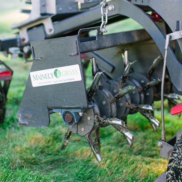 A close-up of a core aeration machine