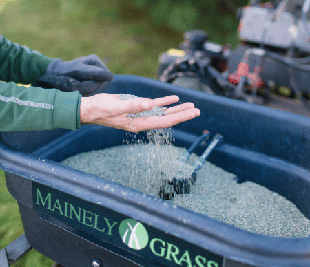 Mainely Grass performing an&nbsp;aeration and overseeding with commercial equipment