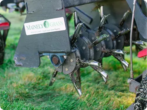 A core aerator used for lawn aeration and overseeding, helping improve soil health and grass growth.